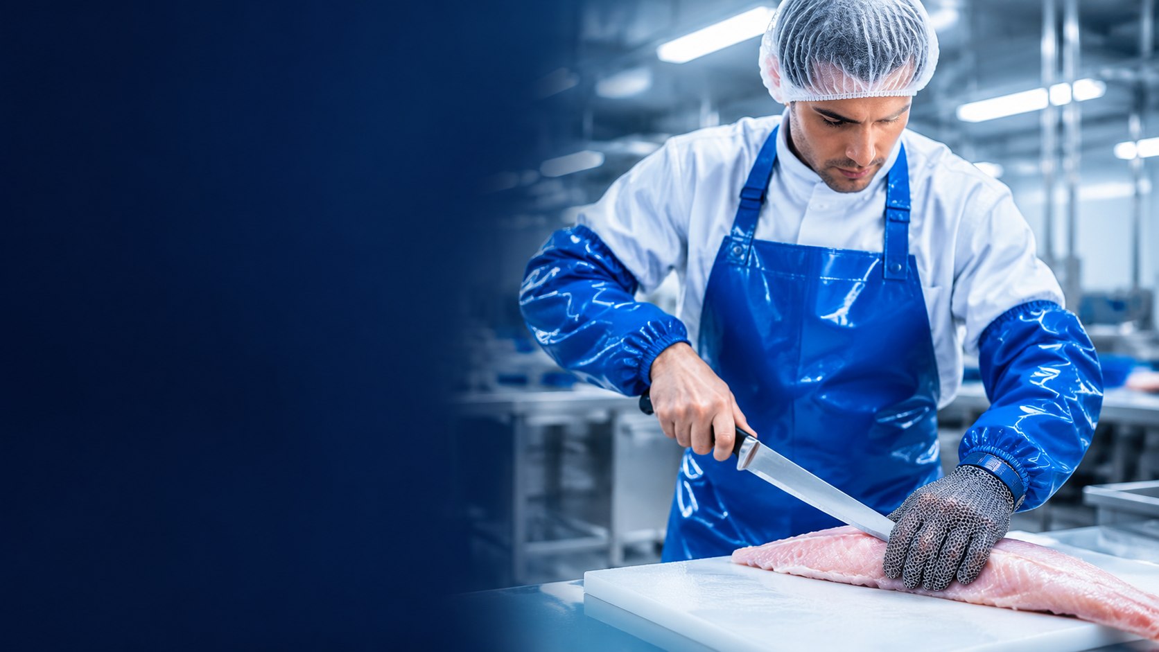 Worker in a TPU apron and oversleeves with a 316L chainmail glove boning meat - NPW protection, cutting and hygiene solutions